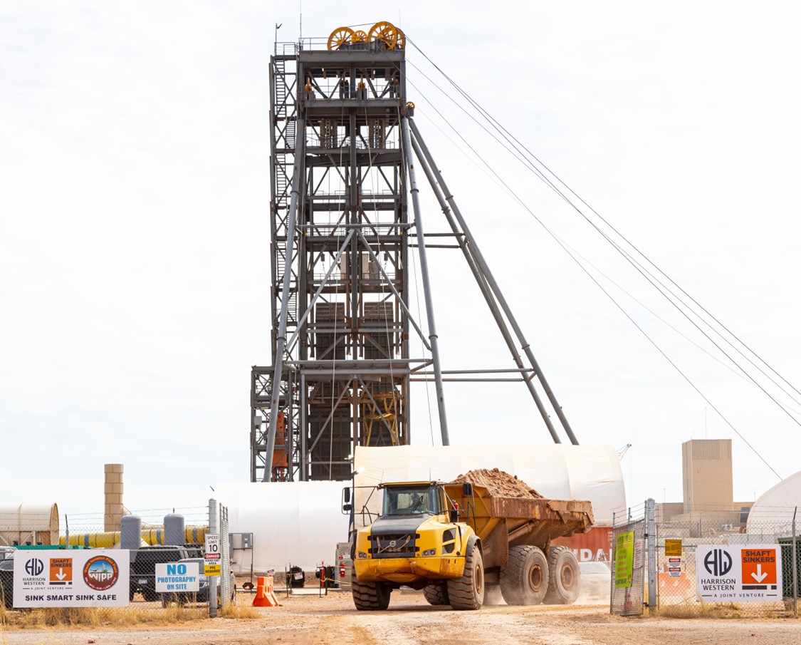 Truck driving away from utility shaft project